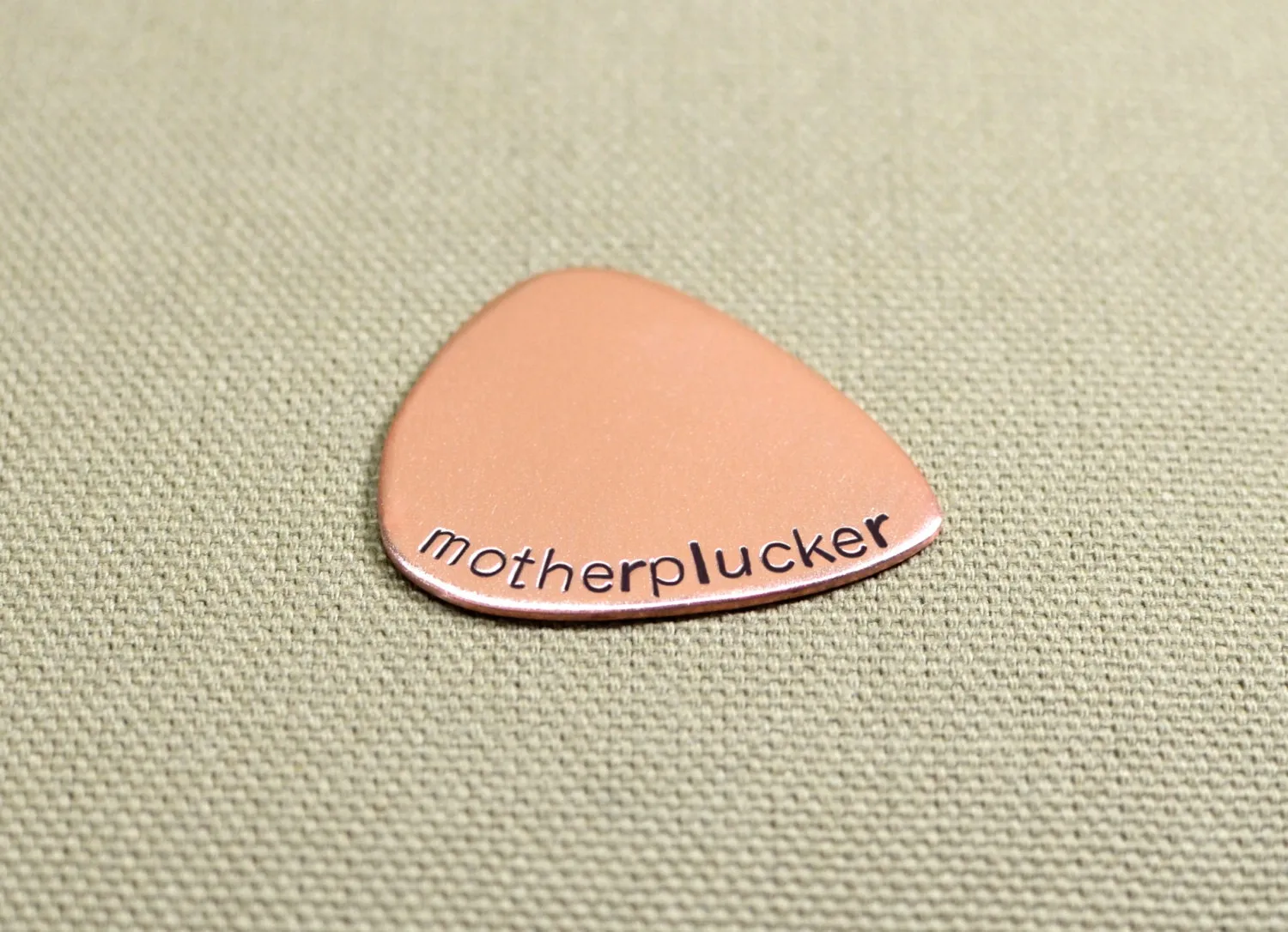 Motherplucker copper guitar pick