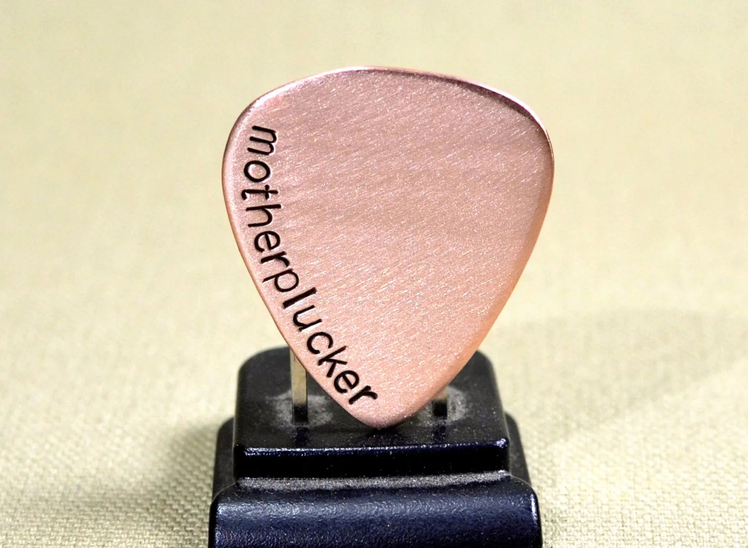 Motherplucker copper guitar pick